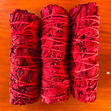 white_sage_and_dragons_blood_smudge_stick_wood_background