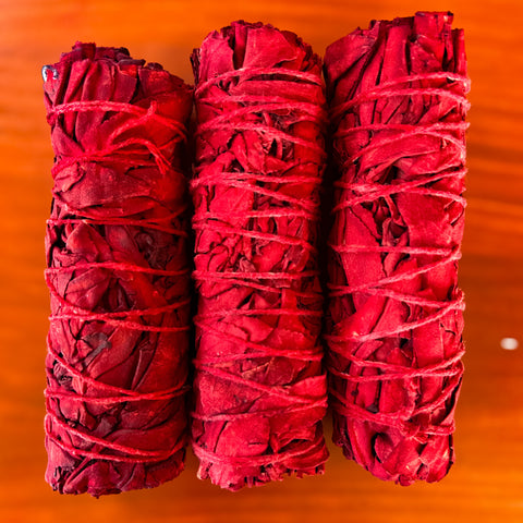 white_sage_and_dragons_blood_smudge_stick_wood_background