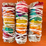 white_sage_seven_chakra_smudge_stick_wood_background