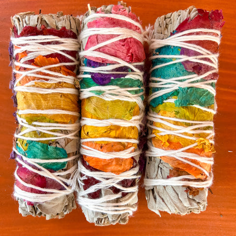 white_sage_seven_chakra_smudge_stick_wood_background