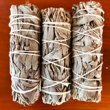 white sage smudge stick 4 inch wood background
