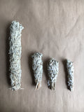 Assorted White sage smudge sticks, 1 large, 1 medium, 1 torch, and 1 mini